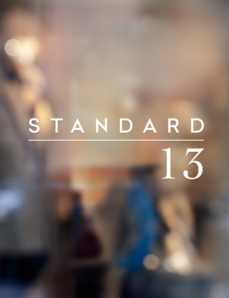 Standard 13 logo on blurred city image